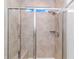 Modern walk-in shower with tile surround, built-in bench, and rainfall showerhead at 935 Piping Plover Ln., Myrtle Beach, SC 29577