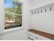 Mudroom with built-in bench, storage, and coat hooks at 1029 Old Plantation Dr., Pawleys Island, SC 29585