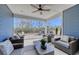 Covered patio with seating area and outdoor fireplace at 1255 Winding Creek Way, Myrtle Beach, SC 29588