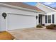 Two-car garage with white doors and holiday decor at 1541 Palmina Loop # D, Myrtle Beach, SC 29588