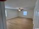 Spacious main bedroom with hardwood floors and ceiling fan at 1608 Fox Hollow Ct., Marion, SC 29571