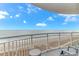 Balcony overlooking the ocean with chairs and table at 1708 N Ocean Blvd. # 902, Myrtle Beach, SC 29577