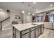 Large kitchen island with seating and a wine rack at 2023 Singing Palm Loop, Little River, SC 29566