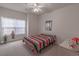 Bedroom with striped bedding and a window at 2033 Silvercrest Dr. # 21-A, Myrtle Beach, SC 29579