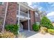 Brick building with white columns and stairs leading to the unit at 2033 Silvercrest Dr. # 21-A, Myrtle Beach, SC 29579