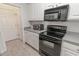 Kitchen with black appliances and white cabinets at 2033 Silvercrest Dr. # 21-A, Myrtle Beach, SC 29579