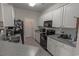 Well-equipped kitchen with white cabinets and black appliances at 2033 Silvercrest Dr. # 21-A, Myrtle Beach, SC 29579