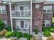 Ground level patio with white railings and access to the unit at 2033 Silvercrest Dr. # 21-A, Myrtle Beach, SC 29579