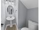 Powder room with pedestal sink and toilet at 2109 N Berwick Dr., Surfside Beach, SC 29575