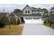 Two-story house with a white double garage and landscaping at 2109 N Berwick Dr., Surfside Beach, SC 29575