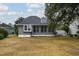 Back of house with sunroom and detached deck at 2109 N Berwick Dr., Surfside Beach, SC 29575