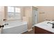 Bathroom with soaking tub, shower, and double vanity at 2346 Windmill Way, Myrtle Beach, SC 29579