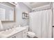 Clean bathroom with a vanity, toilet, and shower/tub combo at 24 Boundary Line Dr. Nw # C, Calabash, NC 28467