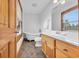 Bathroom with clawfoot tub, wood vanity, and tile floor at 2750 Old Loris Longs Rd, Loris, SC 29569