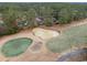 Aerial view of property showcasing a pond, golf course, and surrounding houses at 291 Frances Parker Rd., Georgetown, SC 29440
