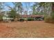 Spacious backyard with grassy lawn, picnic table, and screened porch at 291 Frances Parker Rd., Georgetown, SC 29440