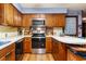 Cozy kitchen features wood cabinets, built-in microwave, and a gas range at 291 Frances Parker Rd., Georgetown, SC 29440