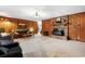 Bright living room with wood paneling, fireplace, and plush seating at 291 Frances Parker Rd., Georgetown, SC 29440