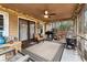 Relaxing screened porch with ceiling fan, grill, and outdoor seating at 291 Frances Parker Rd., Georgetown, SC 29440