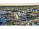 Aerial view showcasing building, pool, and surrounding neighborhood at 301 N Waccamaw Dr. # 109, Garden City Beach, SC 29576
