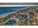 Aerial view of beachfront property, close to the pier at 301 N Waccamaw Dr. # 109, Garden City Beach, SC 29576