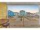 Private balcony with partial view of neighborhood at 301 N Waccamaw Dr. # 109, Garden City Beach, SC 29576