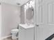 Neat bathroom with a toilet, sink, and vanity with storage at 301 N Waccamaw Dr. # 109, Garden City Beach, SC 29576