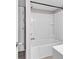 Bathroom with a shower/tub combo and built-in shelving at 301 N Waccamaw Dr. # 109, Garden City Beach, SC 29576