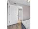 Bedroom with door to bathroom, offering convenience and privacy at 301 N Waccamaw Dr. # 109, Garden City Beach, SC 29576