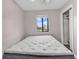 Cozy bedroom with a double bed and a window offering natural light at 301 N Waccamaw Dr. # 109, Garden City Beach, SC 29576