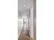 Long hallway with light-colored walls and wood-look floors at 301 N Waccamaw Dr. # 109, Garden City Beach, SC 29576
