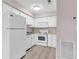 Well-equipped kitchen, featuring white appliances and cabinets at 301 N Waccamaw Dr. # 109, Garden City Beach, SC 29576