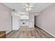 Open concept kitchen with new flooring and white appliances at 301 N Waccamaw Dr. # 109, Garden City Beach, SC 29576