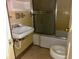 Bathroom with yellow tile and a shower/tub combo at 303 S Withlacoochee Ave., Marion, SC 29571