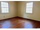 Bright bedroom with hardwood floors and large windows at 303 S Withlacoochee Ave., Marion, SC 29571