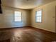 Living room with hardwood floors and large windows at 303 S Withlacoochee Ave., Marion, SC 29571