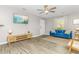 Living room with blue sofa and hardwood floors at 403 71St Ave. N # 1, Myrtle Beach, SC 29572