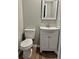 Small bathroom with white vanity, toilet and mirror at 405 Rufus St., Conway, SC 29527