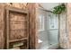 Bathroom with walk-in shower and shelving at 422 Nature Trail Dr., Little River, SC 29566