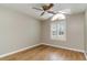 Light beige bedroom with hardwood floors and arched window at 422 Nature Trail Dr., Little River, SC 29566