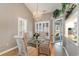 Elegant dining room featuring a glass table and seating for four at 422 Nature Trail Dr., Little River, SC 29566