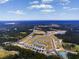 Aerial view of a new residential development with ponds and green spaces at 443 Ribbon Rail Way, Loris, SC 29569