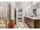 Double vanity bathroom with a walk-in shower and natural light at 4551 Day Lily Run St., Myrtle Beach, SC 29579