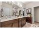 Double vanity bathroom with modern lighting and mirror at 4551 Day Lily Run St., Myrtle Beach, SC 29579