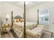 Bedroom with a post bed, nightstand and window at 4551 Day Lily Run St., Myrtle Beach, SC 29579