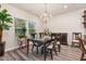 Elegant dining room with chandelier and hardwood floors at 4551 Day Lily Run St., Myrtle Beach, SC 29579