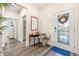 Bright entryway with hardwood floors and a decorative console table at 4551 Day Lily Run St., Myrtle Beach, SC 29579