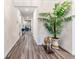 Long hallway with hardwood floors, leading to living areas at 4551 Day Lily Run St., Myrtle Beach, SC 29579