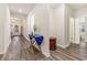 Hardwood floor hallway with coat rack and access to other rooms at 4551 Day Lily Run St., Myrtle Beach, SC 29579