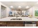 Kitchen island with sink, stainless steel dishwasher, and breakfast bar at 4551 Day Lily Run St., Myrtle Beach, SC 29579